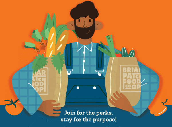 briarpatch shopper owner man with beard holding two brown paper bags filled with fresh groceries